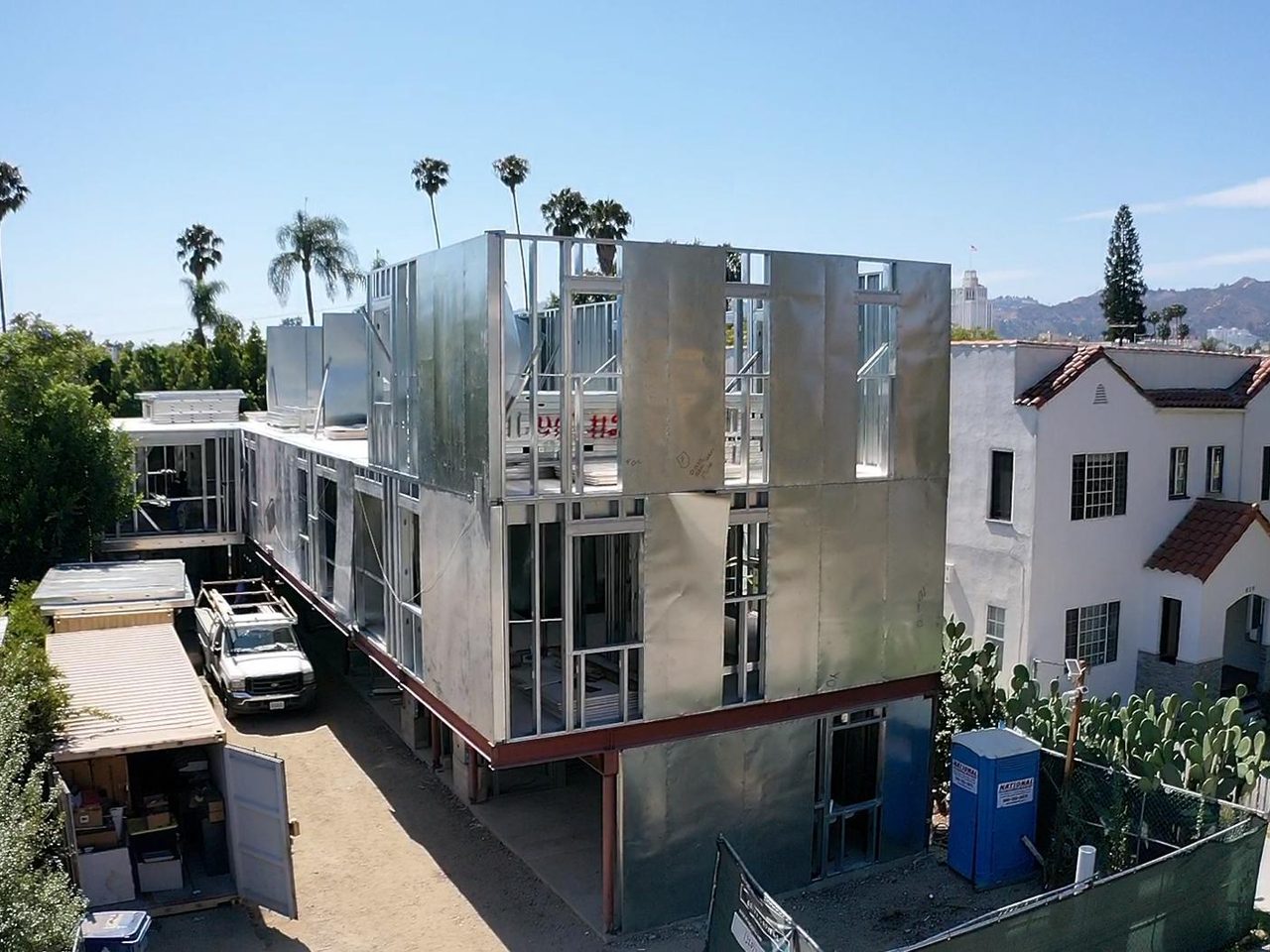 A multi-story residence framed in light gauge steel, seen from above in a Los Angeles neighborhood