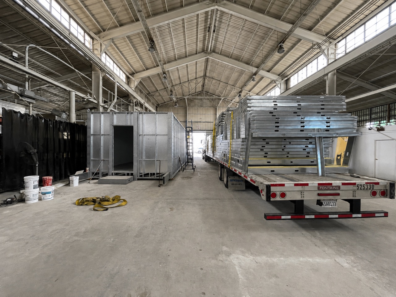 LGS wall panels and a modular unit inside the Cal Steel fabrication facility