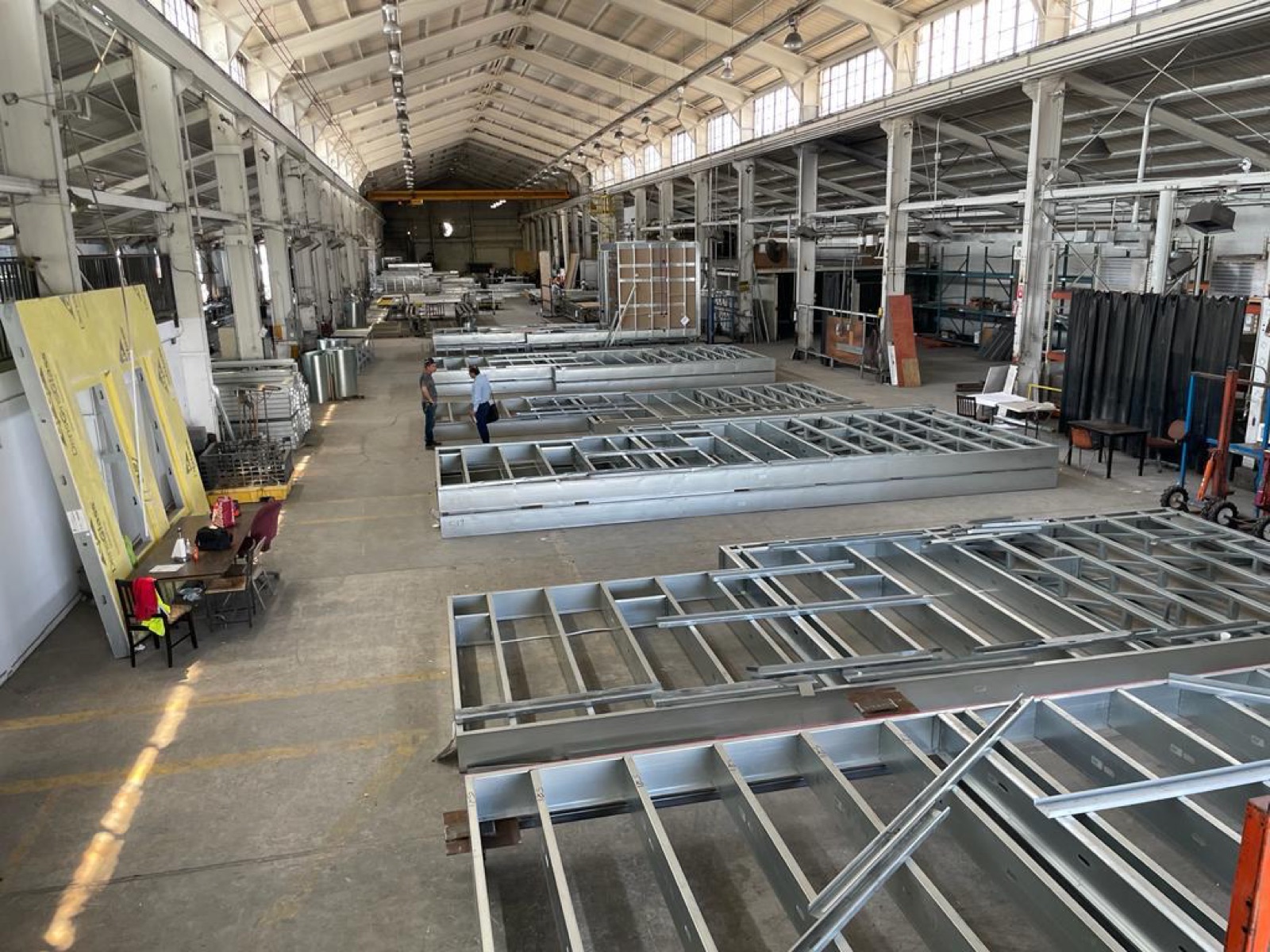 Master steel coils and the slitting line on the Cal Steel production floor.