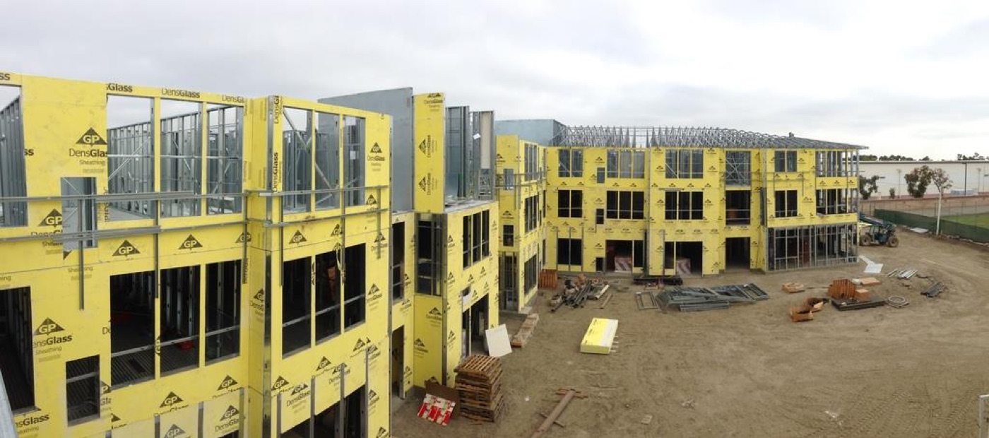 The Merrill Gardens Huntington Beach facility under construction, sheathed over a light gauge steel frame.